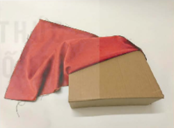 A red cloth covering a box

Description automatically generated