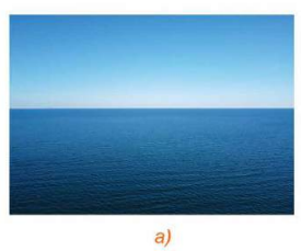 A blue ocean with a clear sky

Description automatically generated