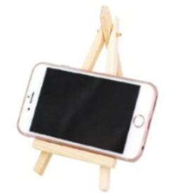 A cell phone on a small wooden easel

Description automatically generated