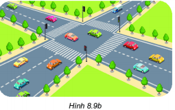 A crosswalk with cars and trees

Description automatically generated