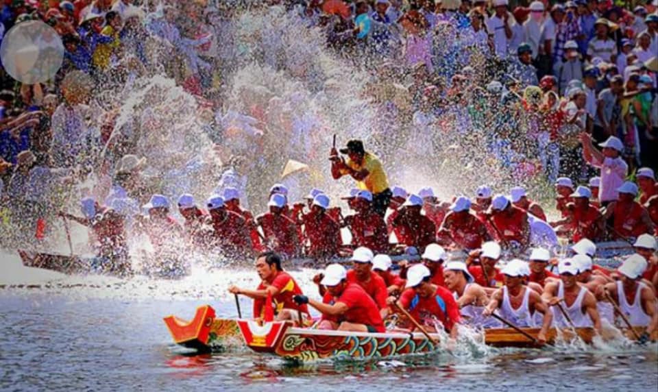 A group of people rowing a boat

Description automatically generated